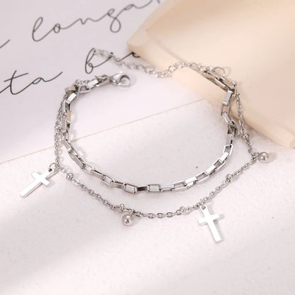 Titanium Cross Charm Bracelet - Premium Jewelry from Dazzling Delights - Just $21.71! Shop now at Dazzling Delights