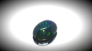 0.60ct Oval Cabochon Black Opal - Premium Jewelry from Dazzling Delights - Just $51.95! Shop now at Dazzling Delights