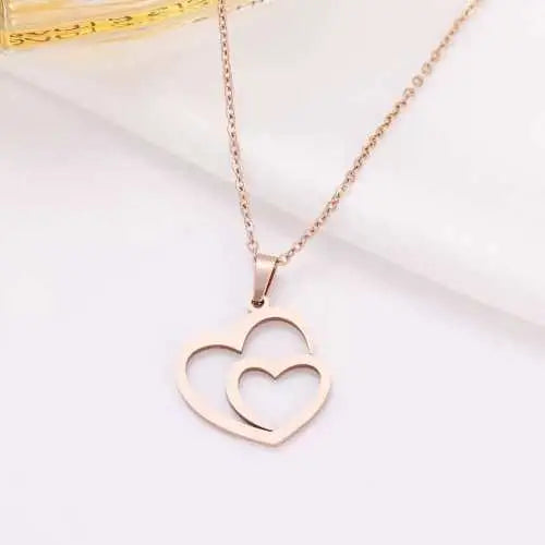 Gold Titanium Double Heart Pendant Necklace - Premium Jewelry from Dazzling Delights - Just $21.71! Shop now at Dazzling Delights