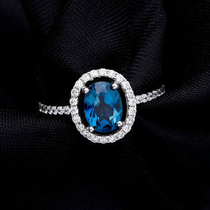 "The Eye of London" 8x6mm Oval Cut Natural London Blue Topaz Halo Ring - Premium Jewelry from Dazzling Delights - Just $82.46! Shop now at Dazzling Delights