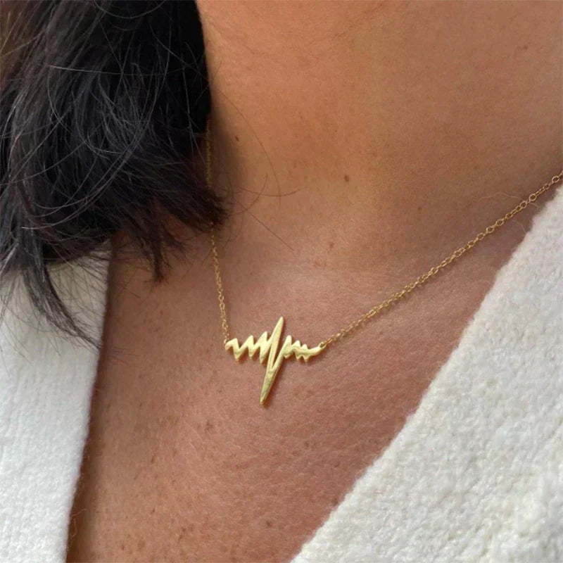 Gold Titanium Heartbeat Pendant Necklace - Premium Jewelry from Dazzling Delights - Just $22.95! Shop now at Dazzling Delights