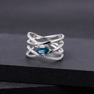 "The Atomic Topaz" London Blue Topaz Crossed Band Ring - Premium Jewelry from Dazzling Delights - Just $56.25! Shop now at Dazzling Delights