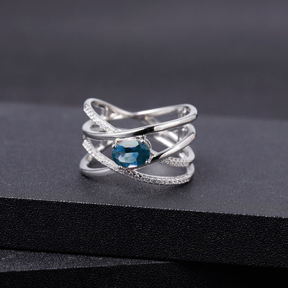 "The Atomic Topaz" London Blue Topaz Crossed Band Ring - Premium Jewelry from Dazzling Delights - Just $92.95! Shop now at Dazzling Delights