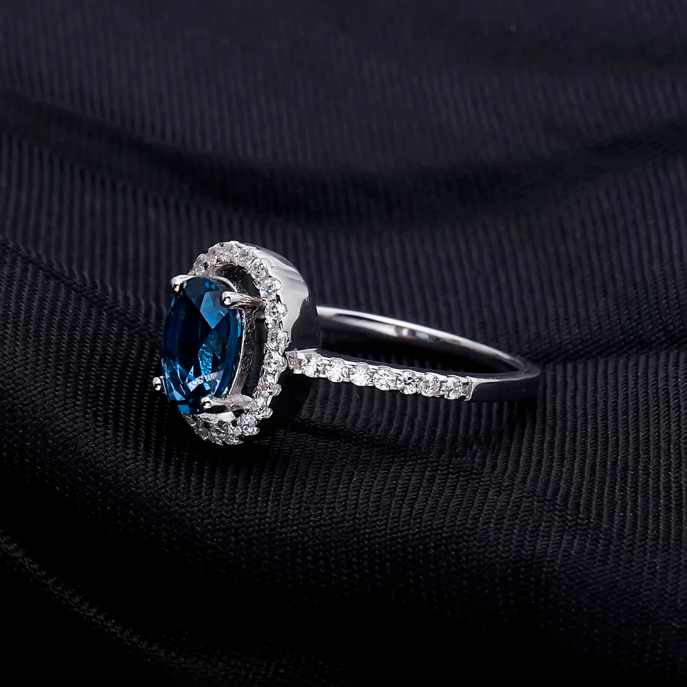 "The Eye of London" 8x6mm Oval Cut Natural London Blue Topaz Halo Ring - Premium Jewelry from Dazzling Delights - Just $82.46! Shop now at Dazzling Delights